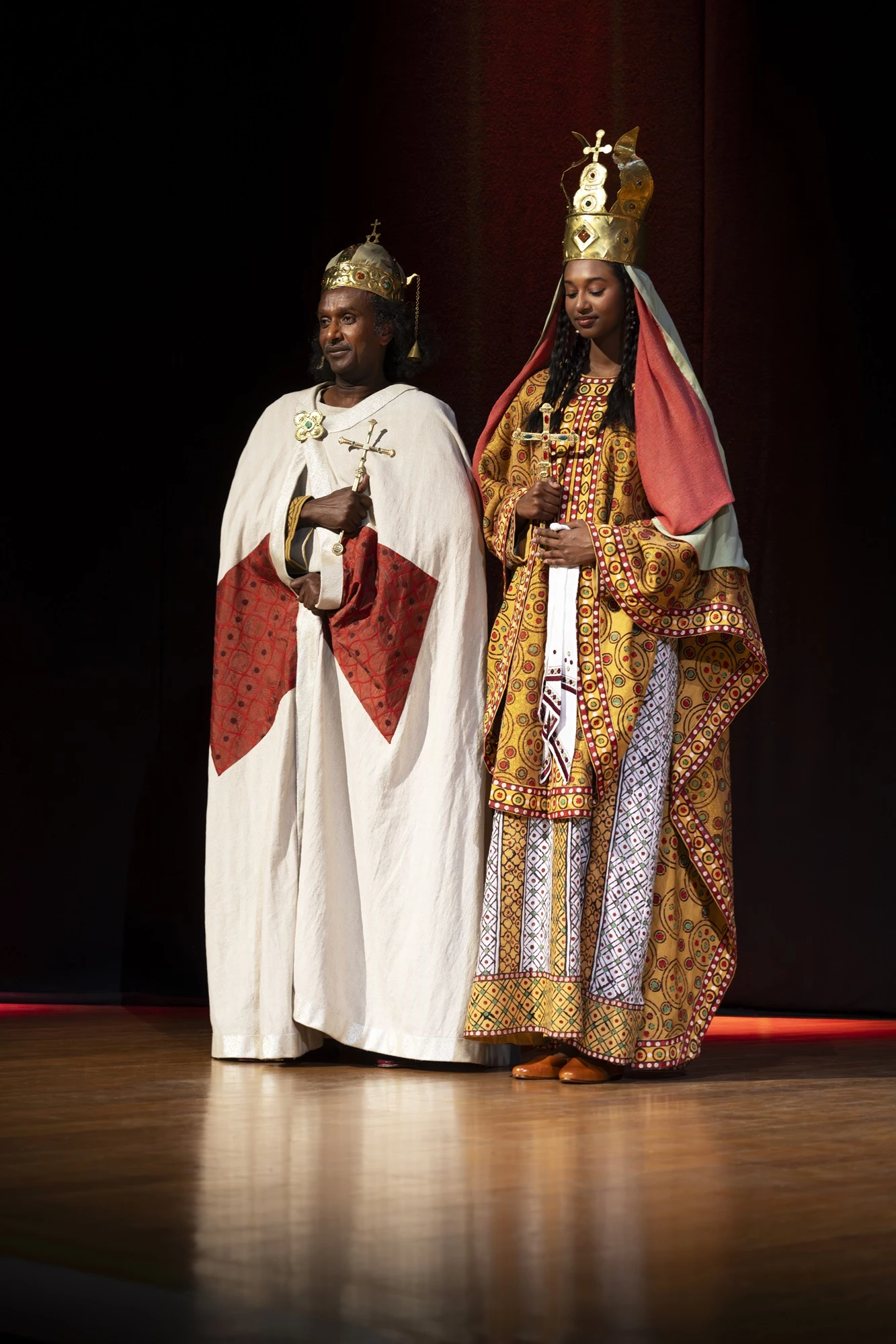A photo of models wearing a reconstructed royal costume from Faras, captured during a presentation in Paris.