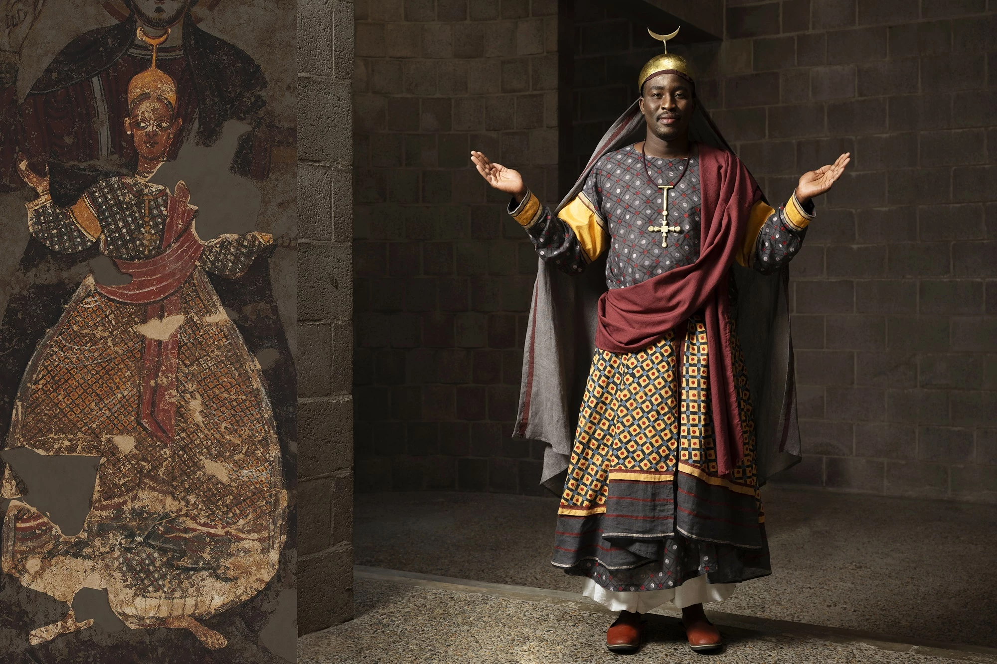 Picture featuring a model wearing a reconstructed outfit inspired by one of Faras’ designs, placed alongside the original Faras painting that inspired the final look.