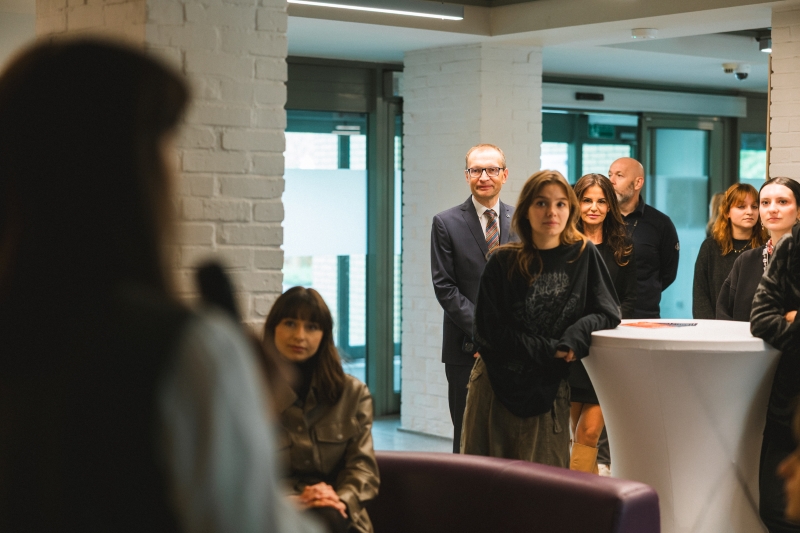 Audience at the opening of the food sharing corner, including the university rector and students.