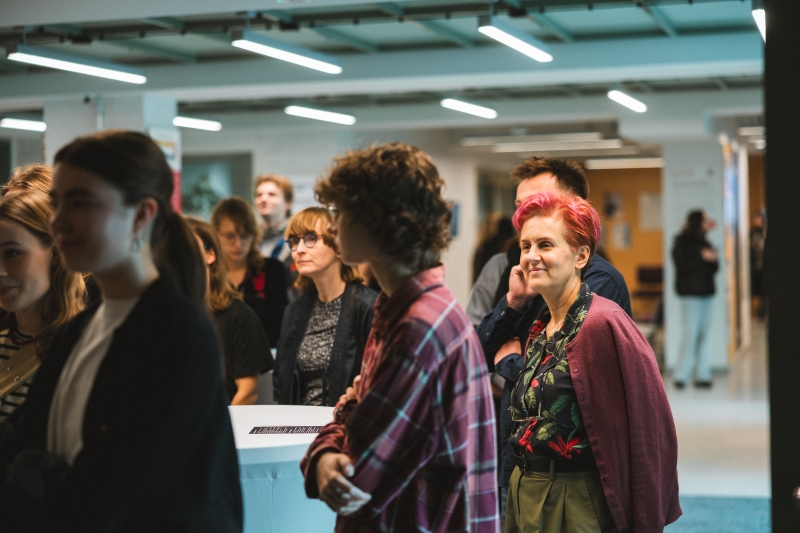 Audience at the food sharing corner opening, including Jolanta Starzak and students.