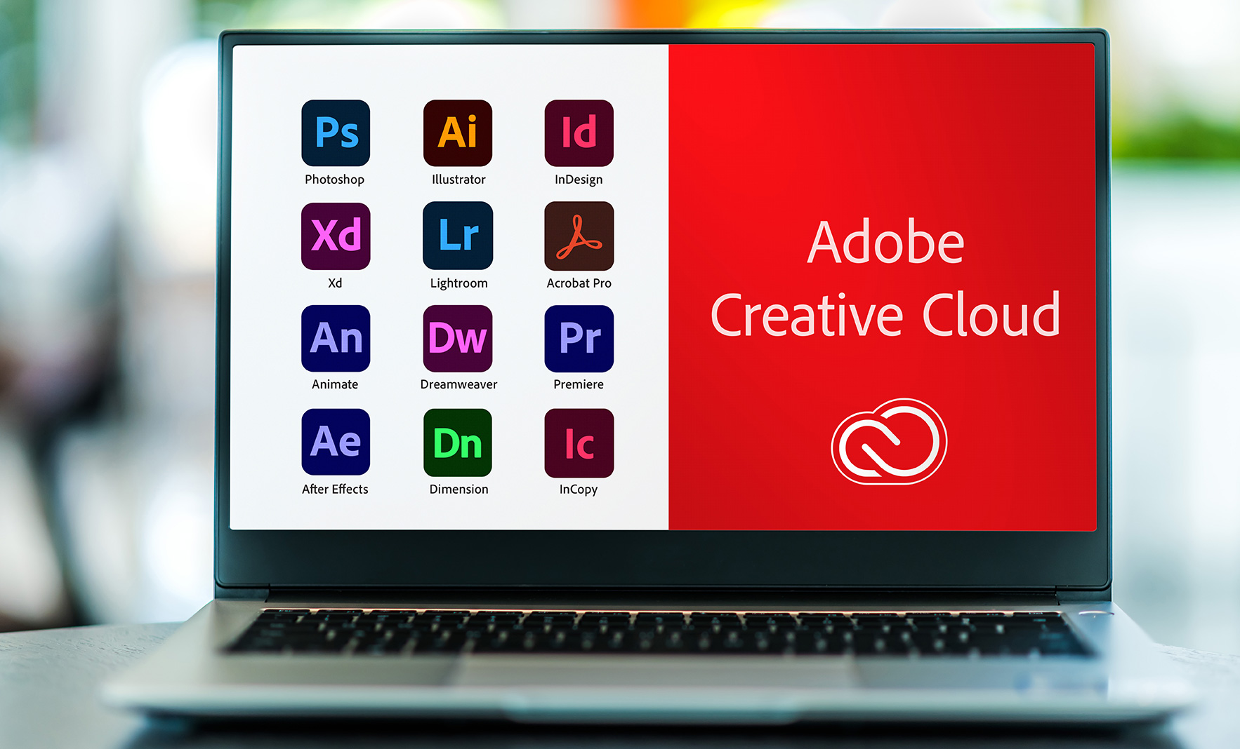Ekran laptopa, na którym wyświetlone są ikony wszystkich programów Adobe Creative Cloud
