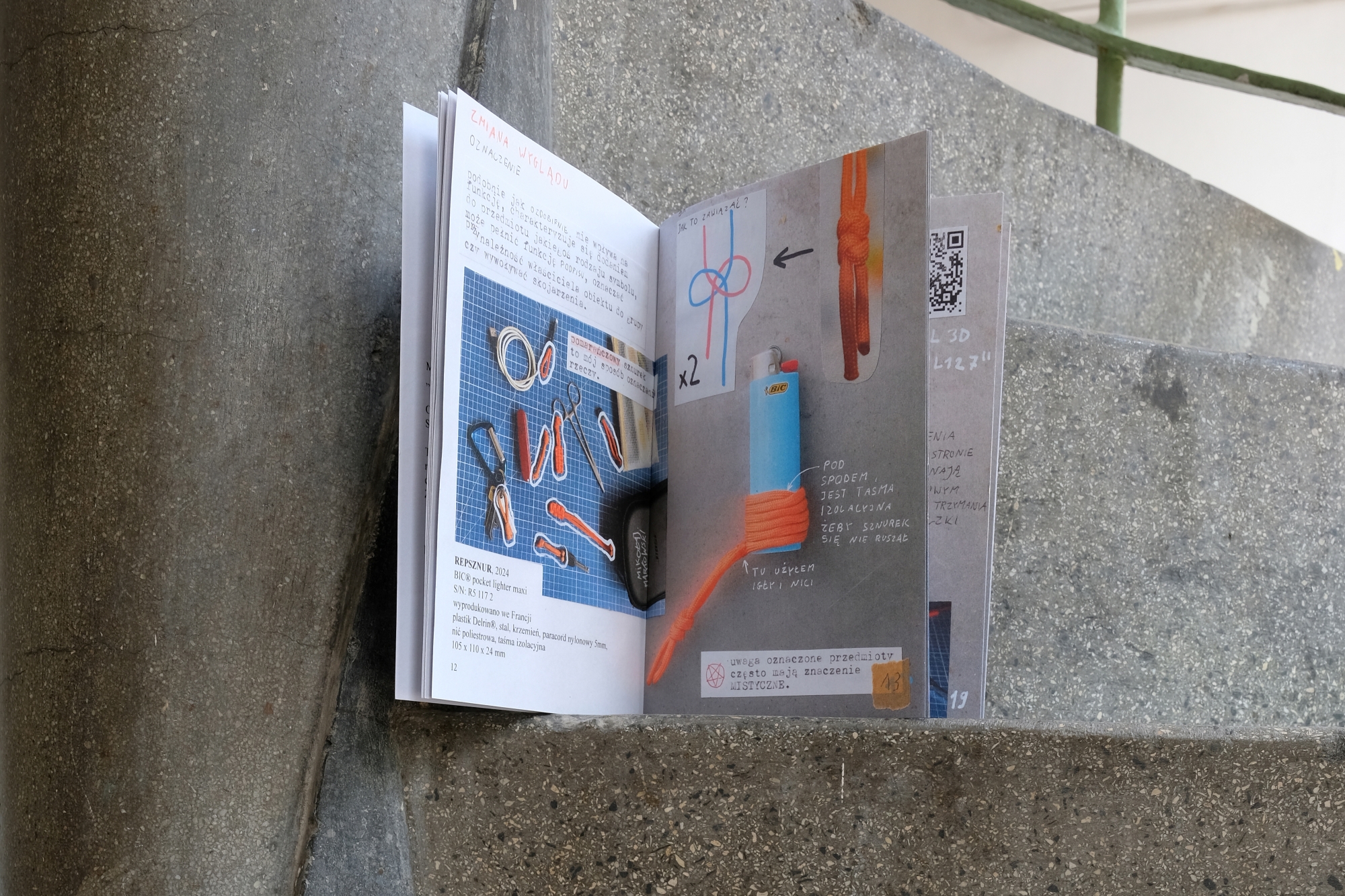 The zine, designed by Mikołaj Markowski, placed on a concrete staircase.