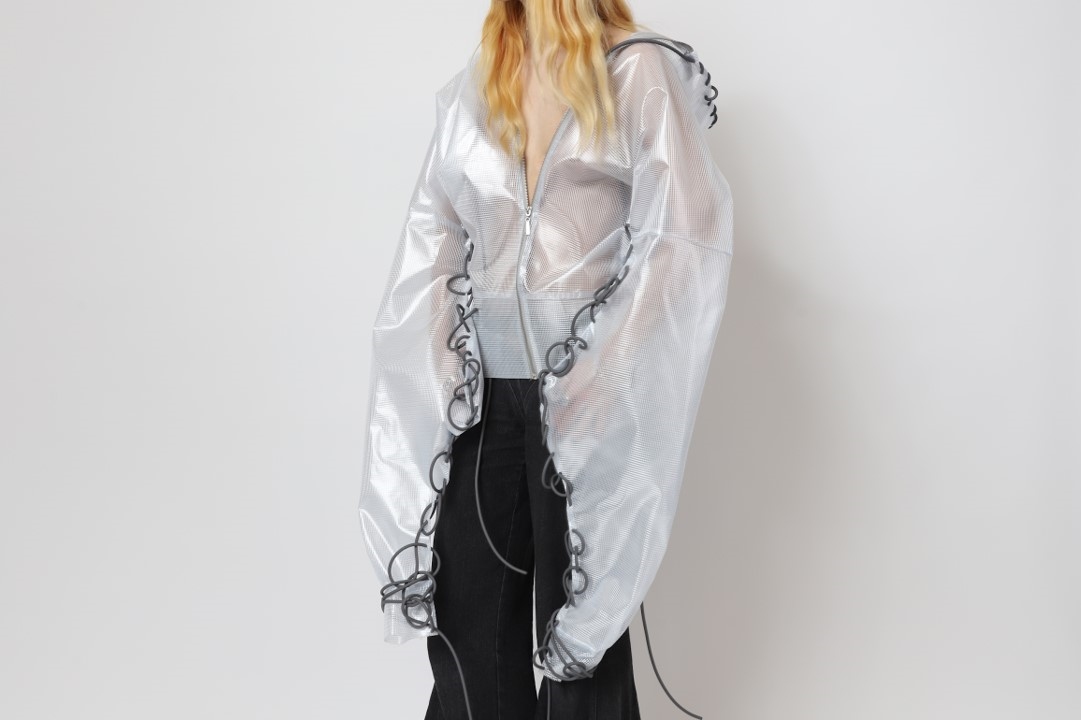 Model wearing a jacket made of roofing membrane