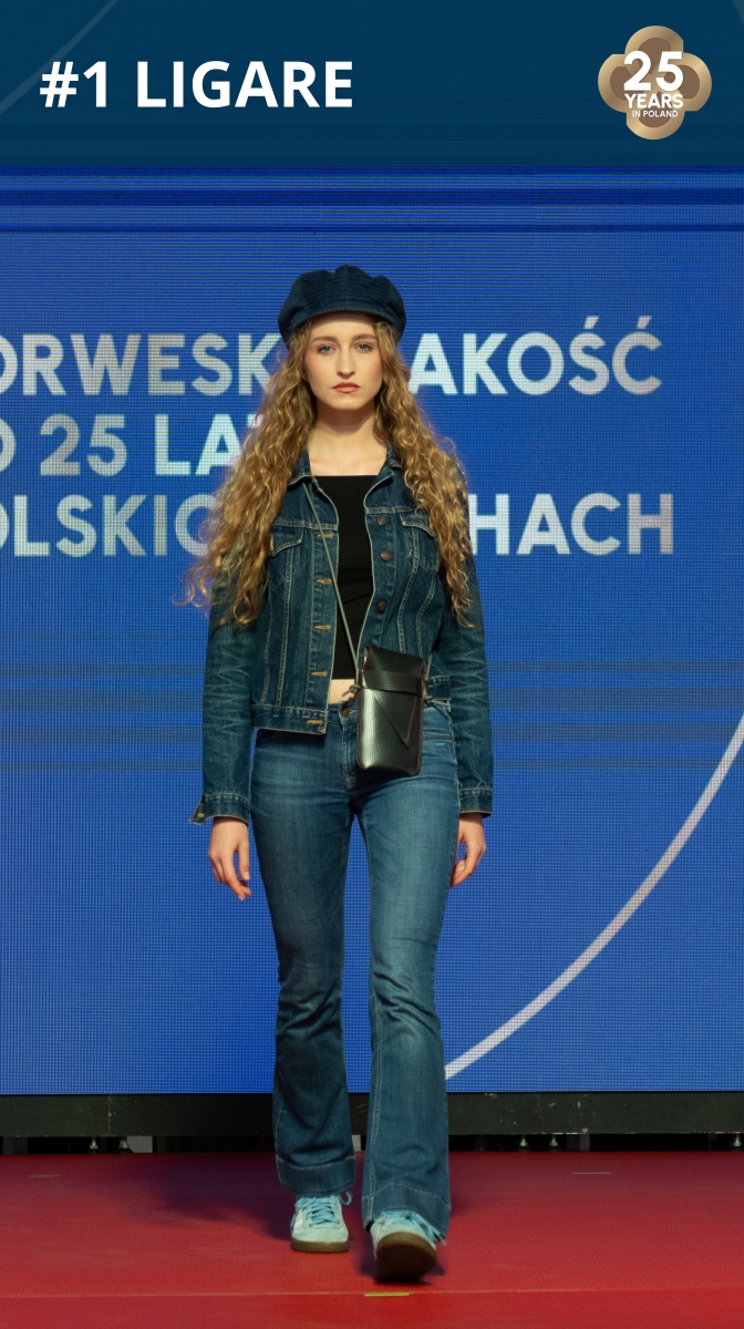 Fashion show: model wearing a handbag made of roofing membrane.