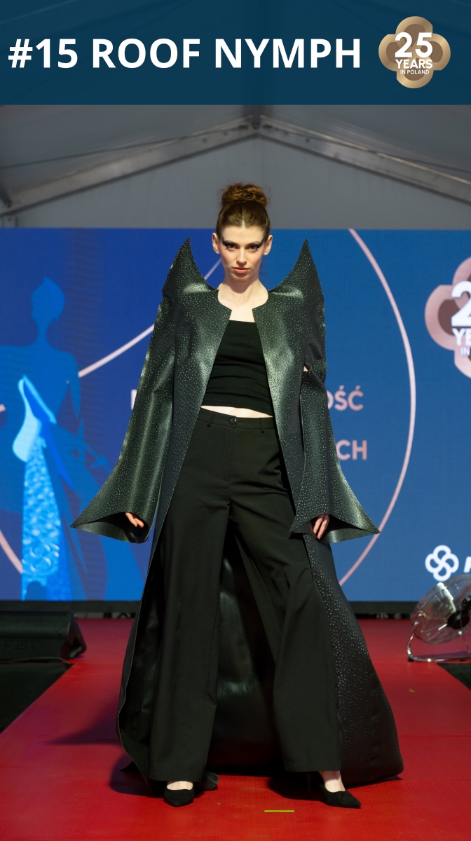 Fashion show: model wearing a coat made of roofing membrane.